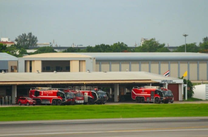 FAA Part 139 fire station with ARFF vehicles.